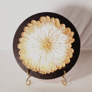 This piece a Hand-Painted Decorative Wall Plate featuring a textured floral design.