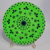 This is a Handcrafted Decorative Wall Plate featuring mirror work with a mandala-inspired floral design on a bright green base.
