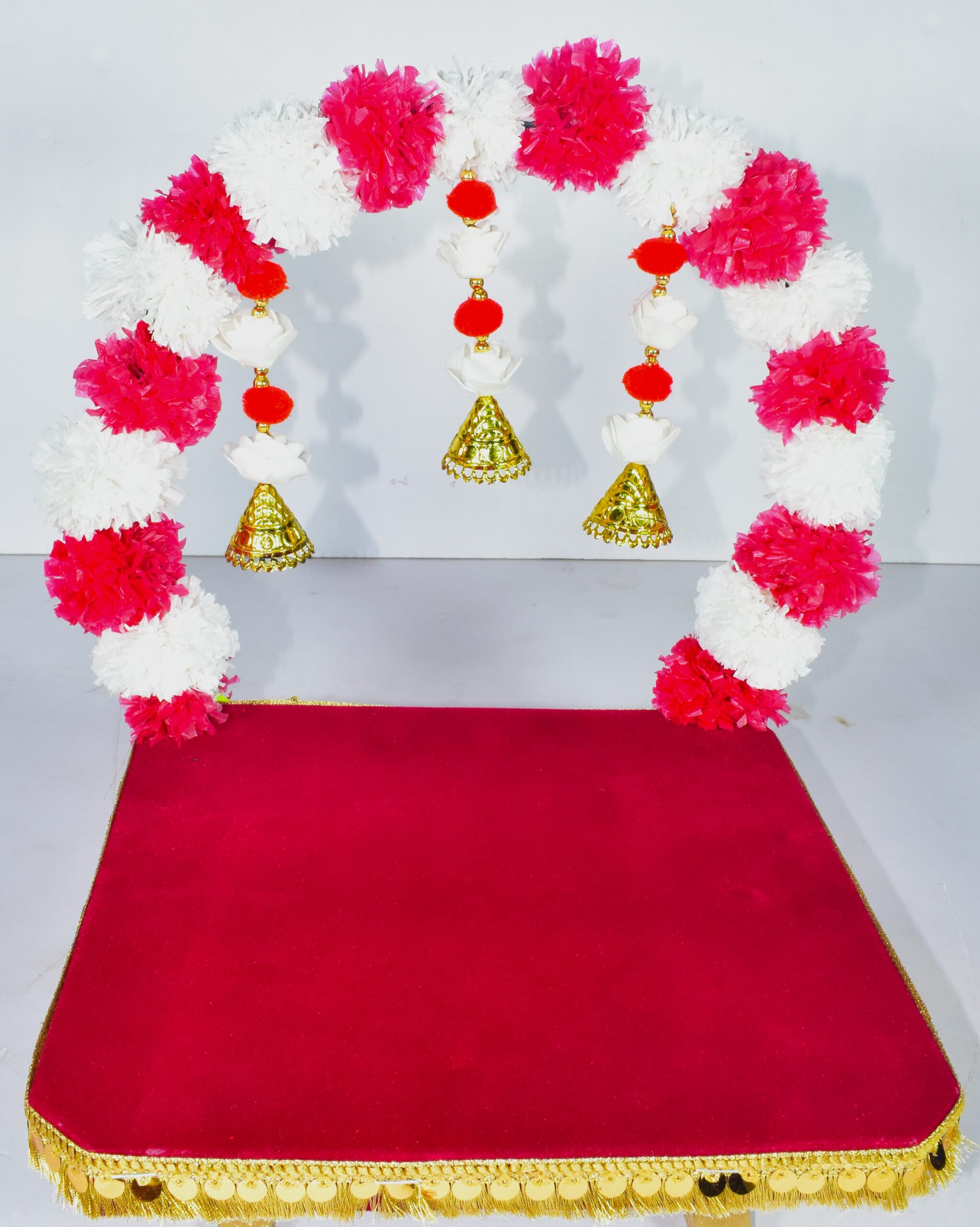 Elegant Red & Gold Pooja Chowki with Floral Arch